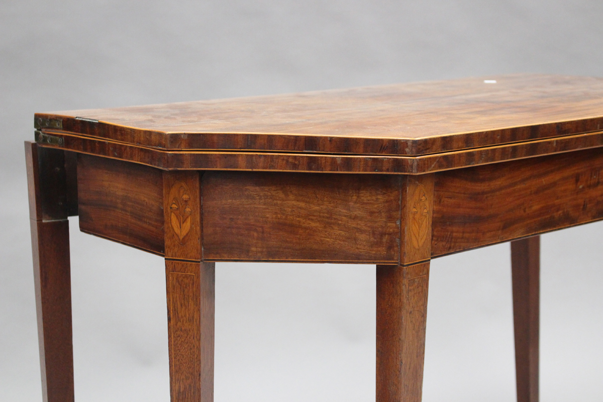 A George III mahogany fold-over tea table, the canted top with boxwood stringing, the frieze with - Image 3 of 3