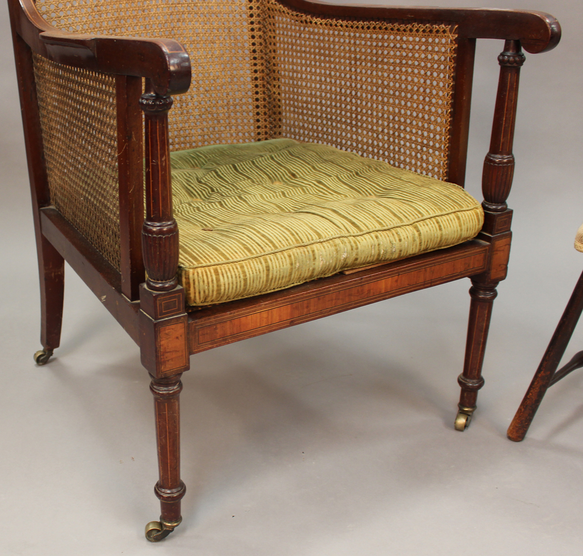 An Edwardian mahogany bergère library armchair, the caned seat, back and side panels within a - Image 3 of 3