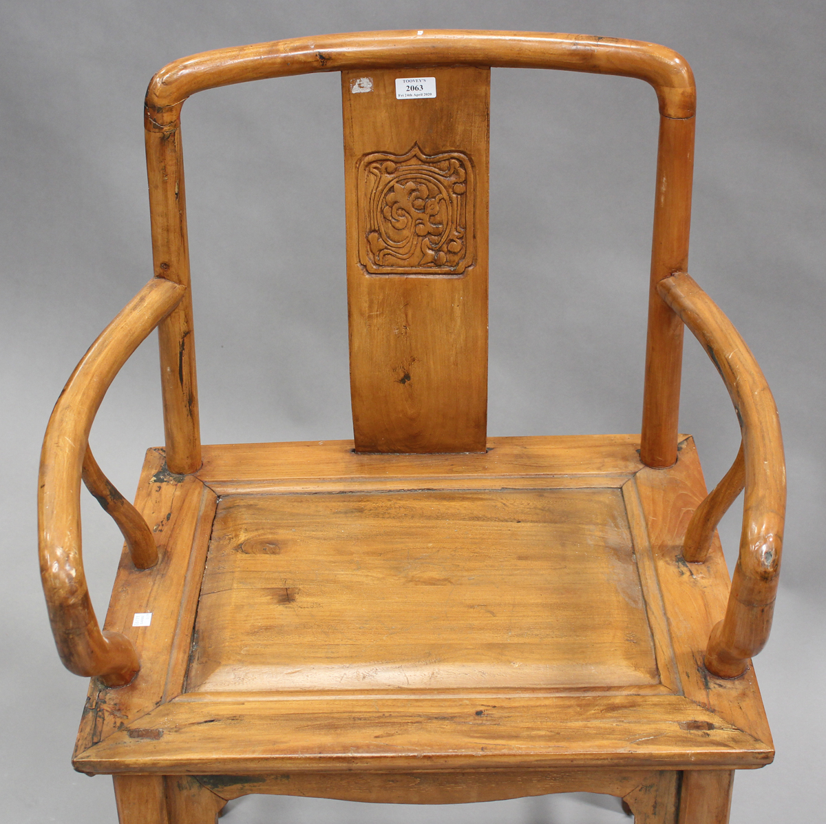 A 20th century Chinese softwood elbow chair with a carved splat back and panelled seat, on block - Image 2 of 2