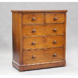 A late Victorian mahogany chest of two short and three long drawers, raised on squat bun feet,