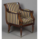 A 20th century Regency style stained hardwood library armchair, the seat, back and arms