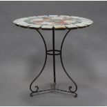 A late 20th century French circular garden table with sectional marble top, raised on a wrought