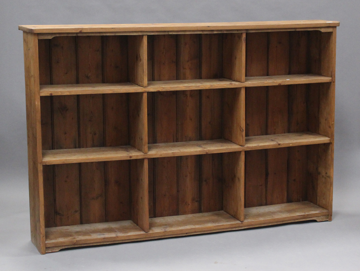 A 20th century reclaimed pine shelf unit, fitted with nine fixed compartments, height 131cm, width