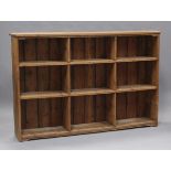 A 20th century reclaimed pine shelf unit, fitted with nine fixed compartments, height 131cm, width