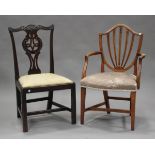 An early George III mahogany dining chair with a pierced and carved splat back above a drop-in seat,