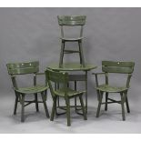 A 20th century green painted slatted wooden garden suite, comprising a circular table, a pair of