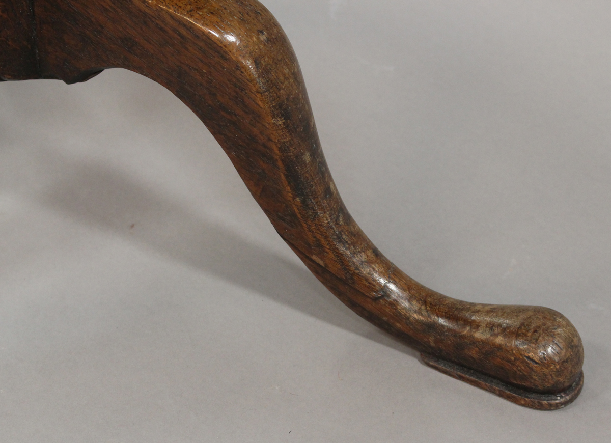 A late George III provincial oak circular tip-top wine table, raised on a turned baluster stem and - Image 2 of 4