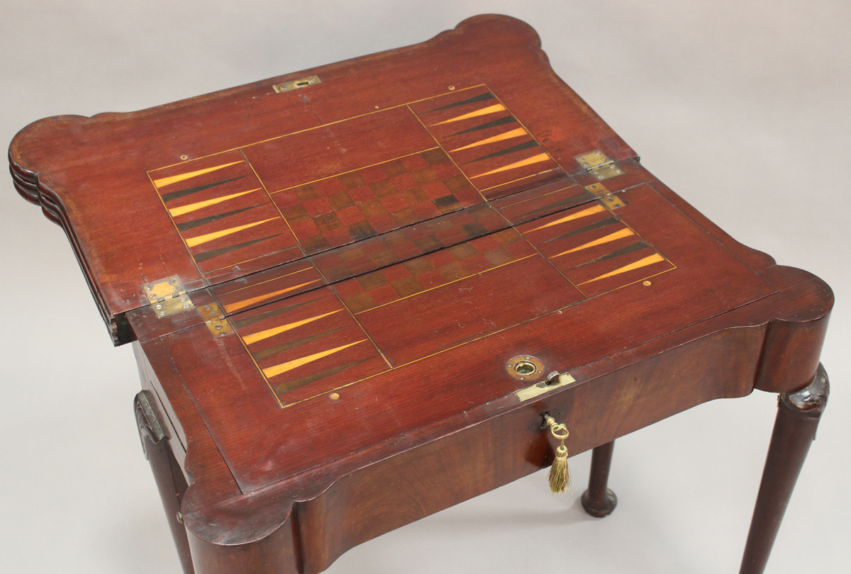 A George II mahogany triple leaf fold-over games and tea table, the hinged top with projecting - Image 5 of 8