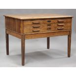 An early 20th century oak three-drawer planner's chest, raised on block legs, height 89cm, width