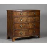 An early Victorian figured mahogany bowfront chest of two short and three long drawers, on bracket