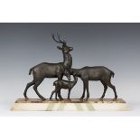 Rochard - an Art Deco patinated cast spelter model group depicting a family of deer, all standing on