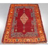 A Garabagh rug, South-east Caucasus, early 20th century, the deep claret field with an ivory