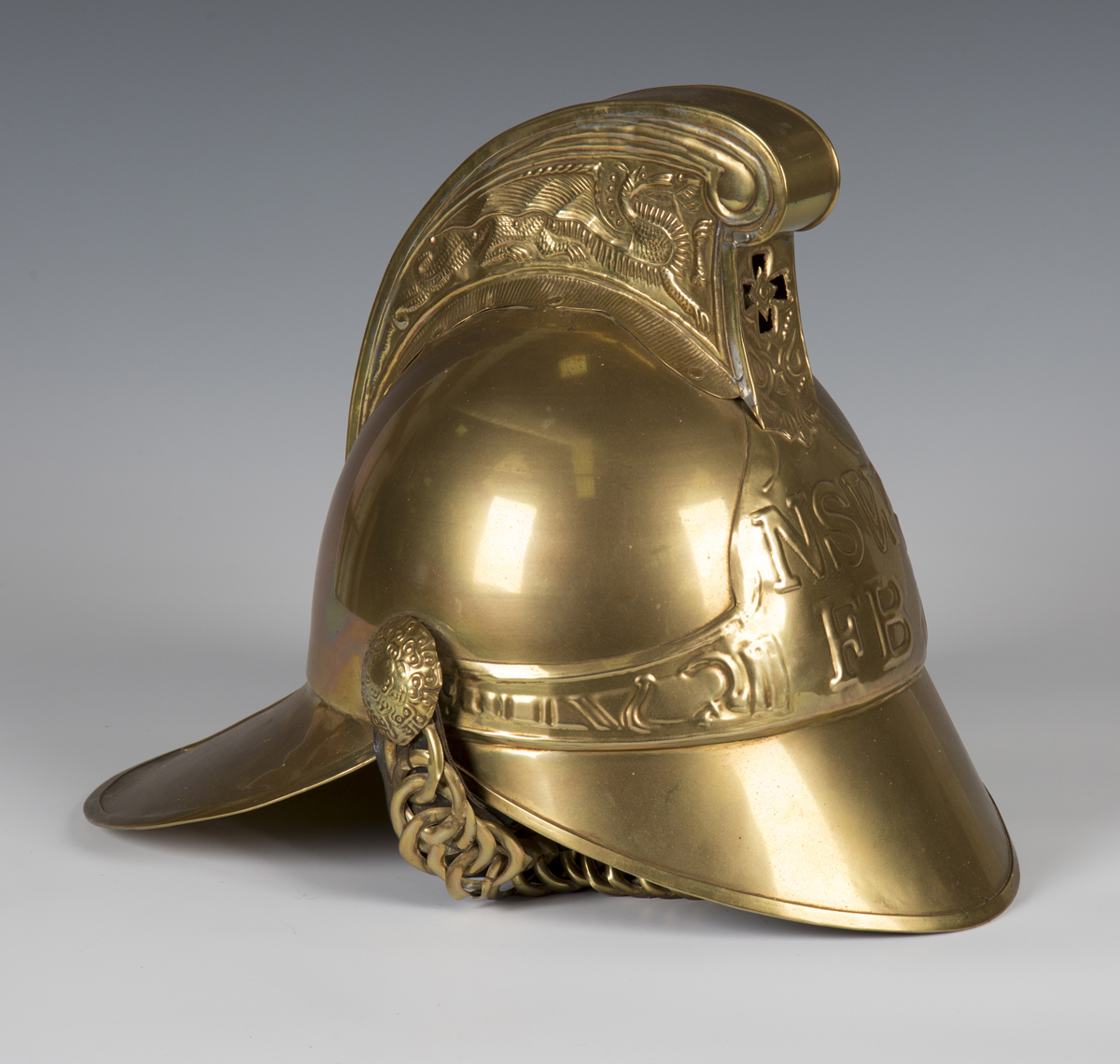 A late 20th century brass copy of a Victorian fireman's helmet, height 27cm.Buyer’s Premium 29.4% (