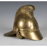 A late 20th century brass copy of a Victorian fireman's helmet, height 27cm.Buyer’s Premium 29.4% (