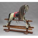 A 20th century carved and painted rocking horse by 'The Traditional Rocking Horse Co', bearing