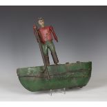 A late 19th century Dutch carved and painted wooden weather vane, naively modelled as a man standing