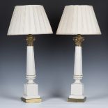 A pair of late 20th century white glazed pottery and gilt metal mounted Corinthian column table