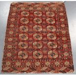 A small Tekke rug, West Turkestan, early 20th century, the claret field with three columns of