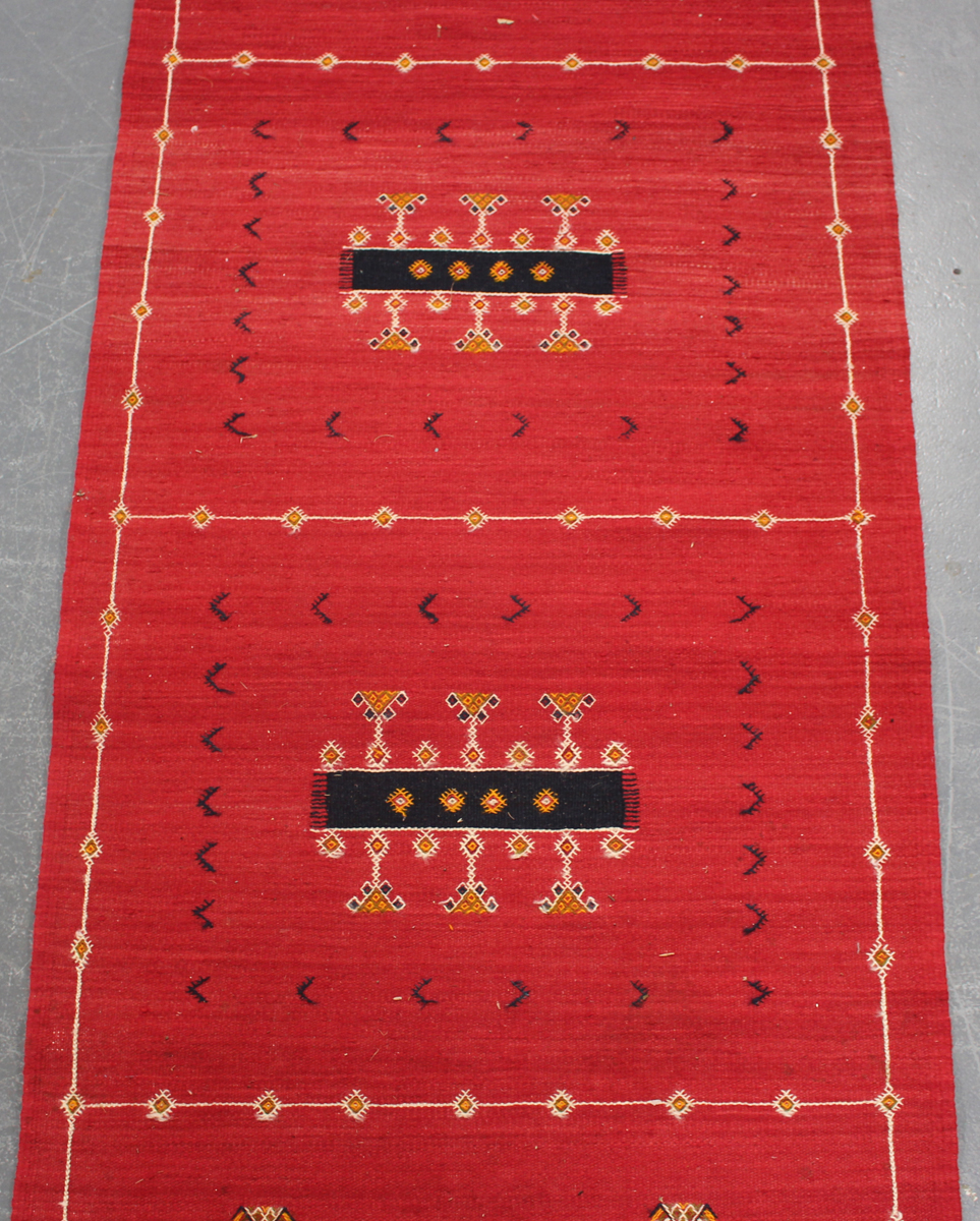 An Afghan kelhim runner, late 20th century, the claret field sparsely decorated with stylized - Image 4 of 4