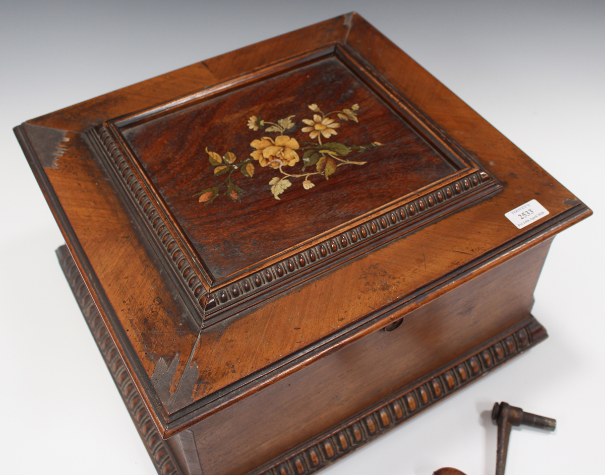 A late 19th century walnut cased Symphonium, playing 33.5cm discs, the hinged lid with transfer - Image 2 of 4