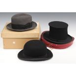 A black bowler hat by Lock & Co, London, head aperture 20.6cm x 15.7cm, together with a grey