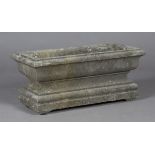 A 19th century French carved limestone rectangular garden planter of neoclassical design, the ogee