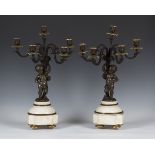 A pair of mid-19th century French brown patinated cast bronze and Carrara marble five-light