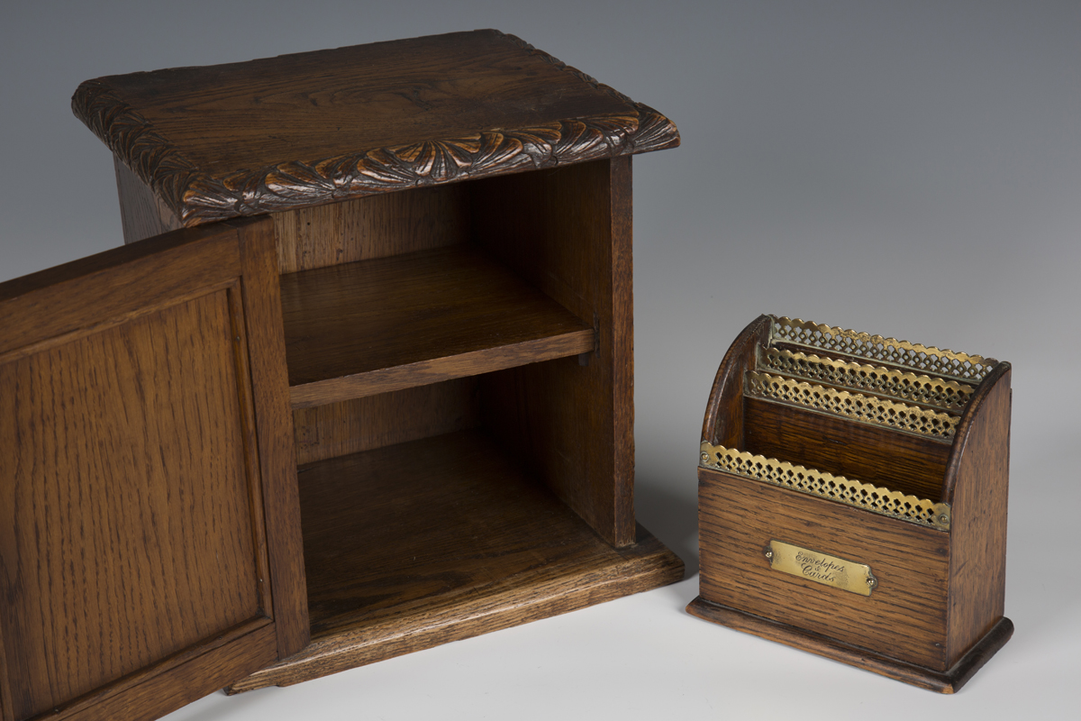 A late Victorian carved oak table-top box, the door carved with heraldic crest above dates '1393- - Image 2 of 2