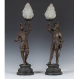 A pair of late 19th century French brown patinated cast spelter figural table lamps, modelled in the