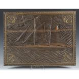 An early/mid-20th century French carved oak relief panel depicting a ship, a coastal village in
