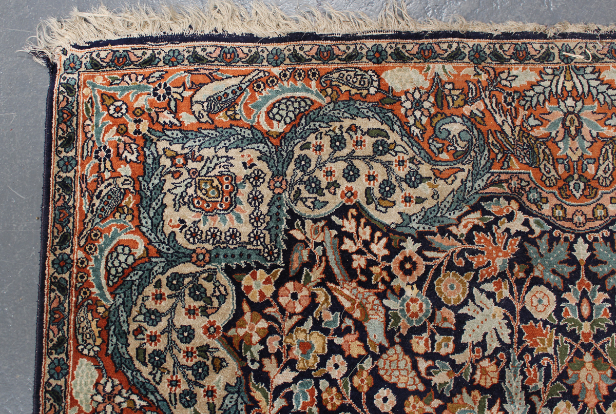 A Turkish part silk rug, late 20th century, the midnight blue field with a flowerhead medallion, - Image 4 of 4