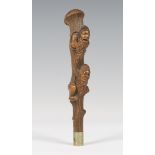A late 19th century Swiss Black Forest carved softwood novelty walking cane handle, finely