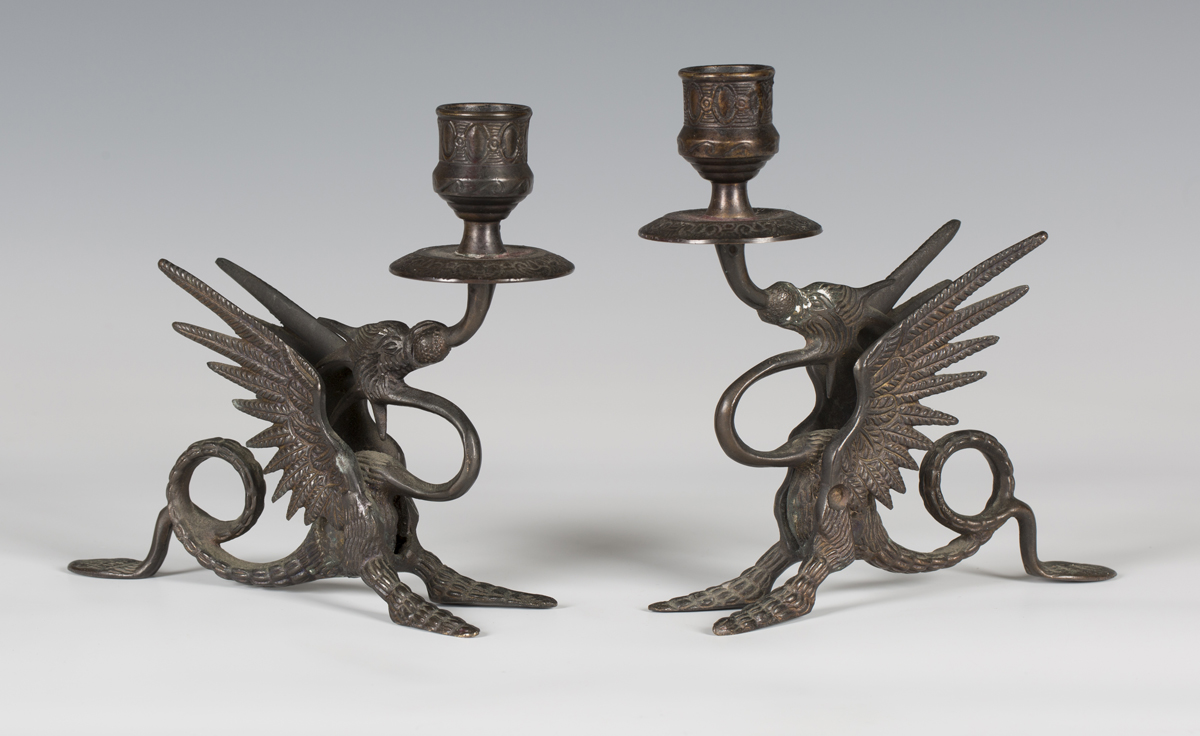 A pair of 20th century Victorian style brown patinated cast bronze chambersticks in the form of