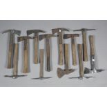 A collection of fireman's and other hand axes, all with wooden handles.Buyer’s Premium 29.4% (