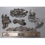 A group of late 19th and early 20th century decorative cast iron and polished steel items, including