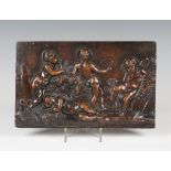 An 18th century Flemish carved walnut rectangular panel, worked in relief with four putti harvesting