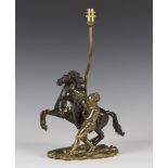 An early 20th century French gilt and brown patinated cast bronze table lamp in the form of a