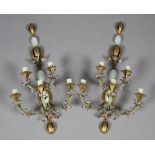 A pair of late 20th century gilt and green tole painted five-light wall sconces of foliate form,