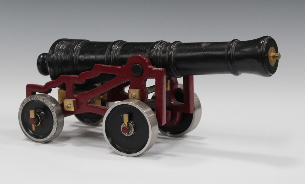 A Victorian cast iron model of an English fort/garrison gun, circa 1860, length of barrel 37.5cm, on