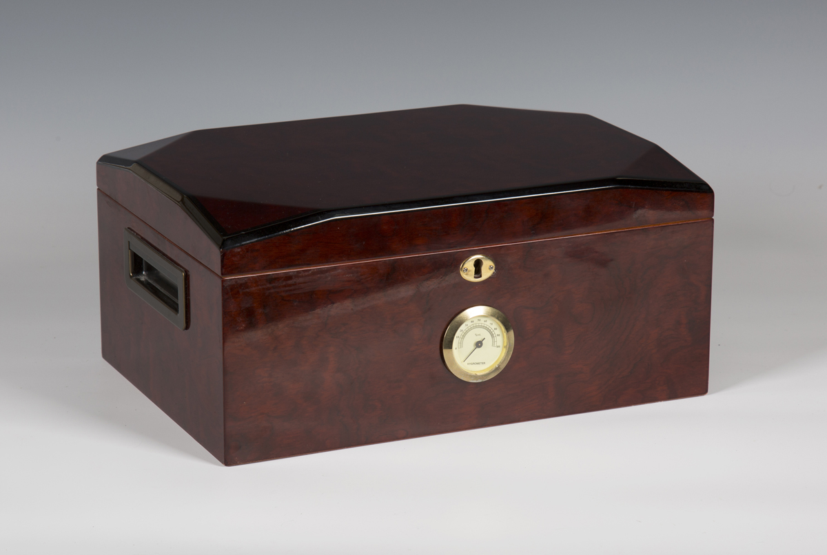 A late 20th century stained wooden cigar humidor, the front with inset hygrometer, width 34cm.