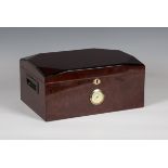 A late 20th century stained wooden cigar humidor, the front with inset hygrometer, width 34cm.