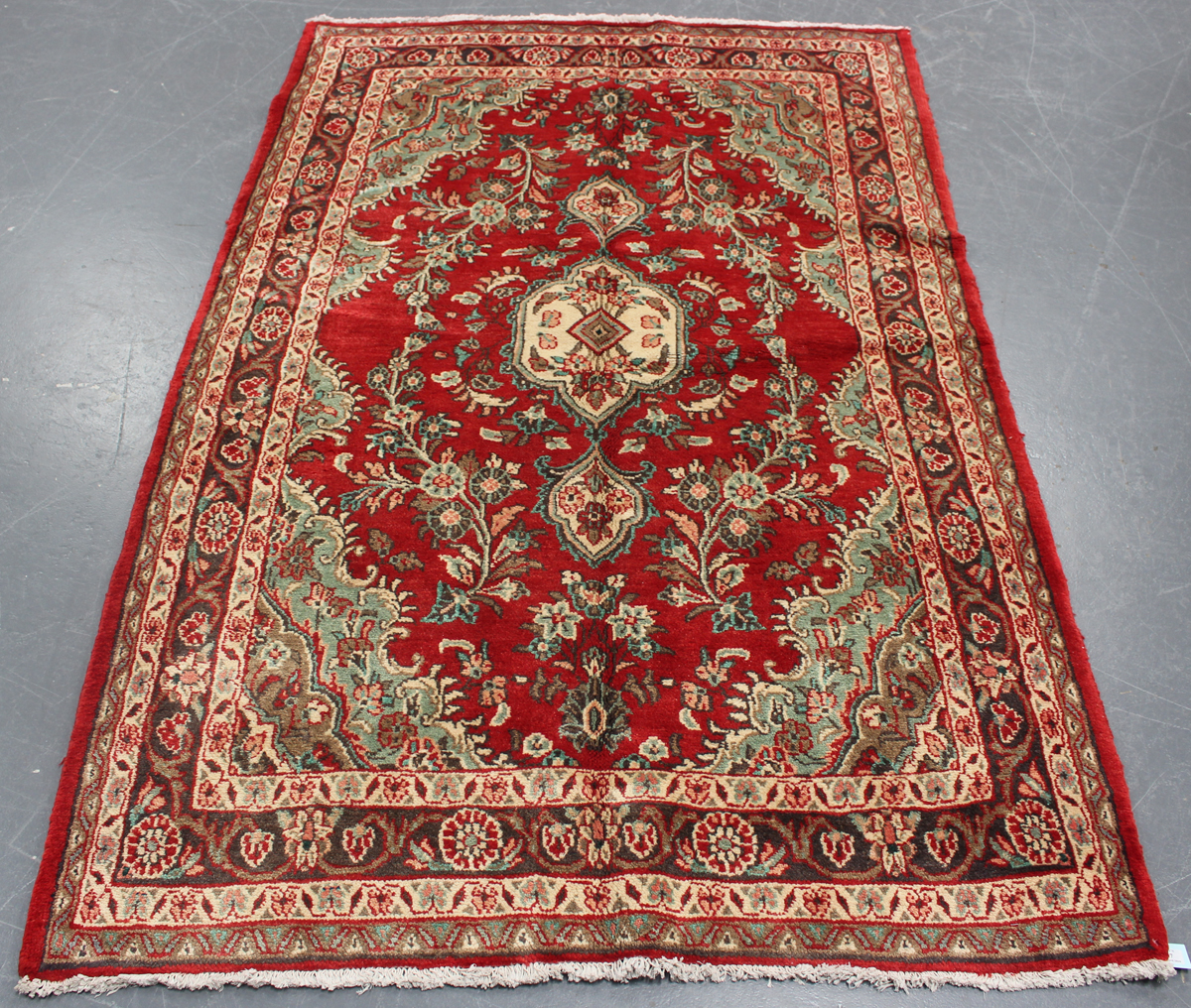 A Jozan rug, North-west Persia, mid/late 20th century, the red field with an ivory medallion