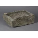 A 19th century carved and chipped stone garden trough of rectangular form, height 20cm, width