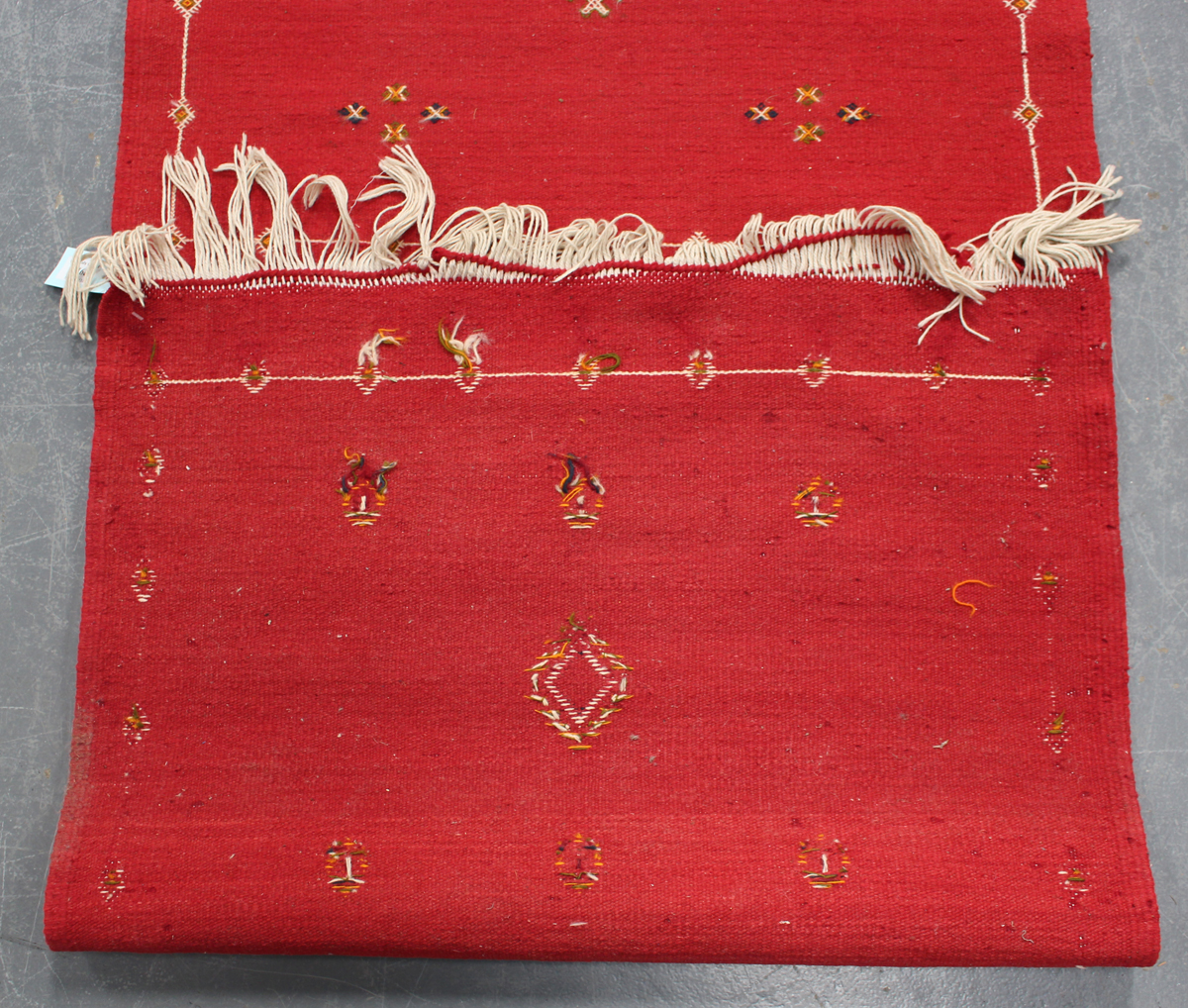 An Afghan kelhim runner, late 20th century, the claret field sparsely decorated with stylized - Image 2 of 4