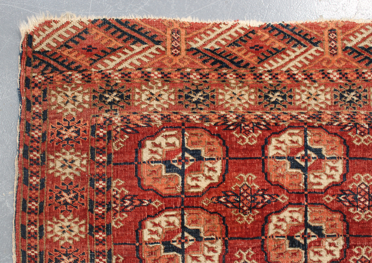 A small Tekke rug, West Turkestan, early 20th century, the claret field with three columns of - Image 3 of 3