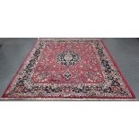 A Mashad carpet, Central Persia, mid-20th century, the pale puce field with a floral medallion,