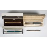 A Parker gold plated fountain pen, the nib detailed '14K', cased, a Parker 51 fountain pen, cased, a