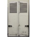 Three pairs of early 20th century French louvre shutter doors, height of arched pair 182cm, width