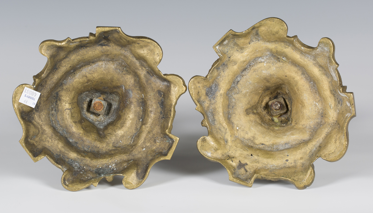 A pair of Rococo gilt bronze candlesticks of foliate scrolling form, height 28cm (lacking sconces). - Image 3 of 3