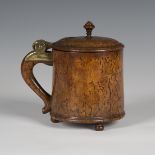 An 18th century Norwegian burr birch peg tankard, the lid with applied brass hinge and turned